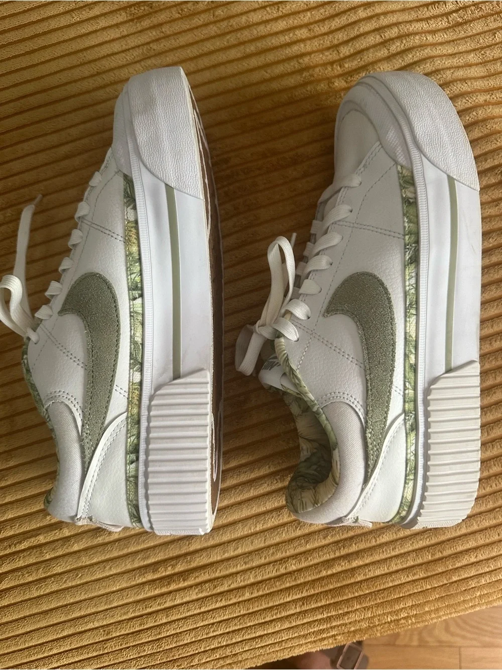 Nike Women's White Sneakers with Olive Swoosh and Leaf-Print Collar